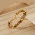 Retro Spiral Bangle In Stainless Steel With 18K Gold Plated Finish - TIRAAYA