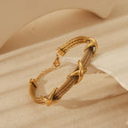 Retro Spiral Bangle In Stainless Steel With 18K Gold Plated Finish - TIRAAYA