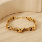 Retro Spiral Bangle In Stainless Steel With 18K Gold Plated Finish - TIRAAYA