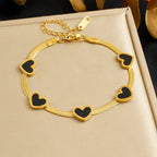 Elegant Heart Multi Pendant Bracelet With Gold Plated Finish - TIRAAYA