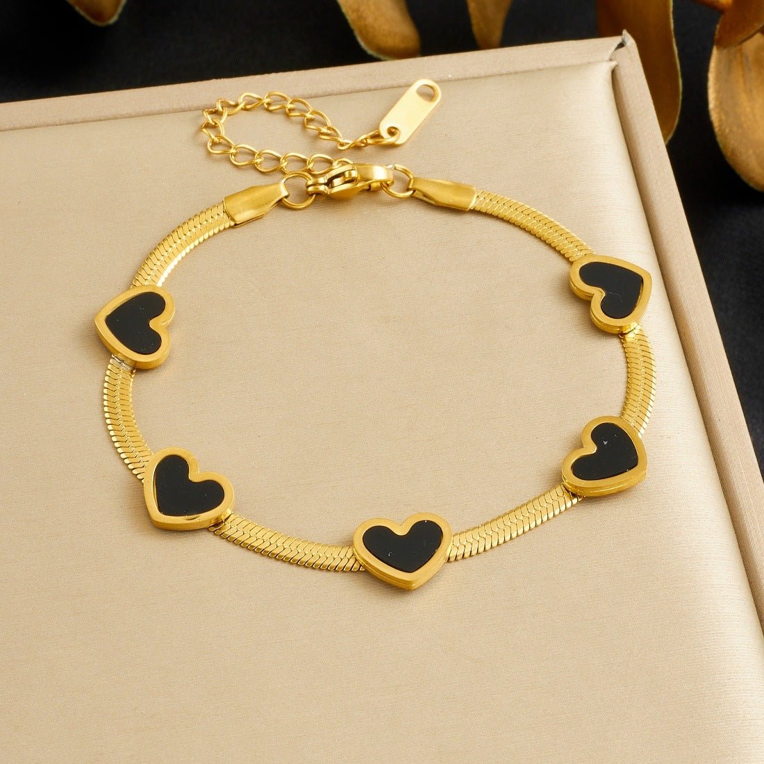 Elegant Heart Multi Pendant Bracelet With Gold Plated Finish - TIRAAYA