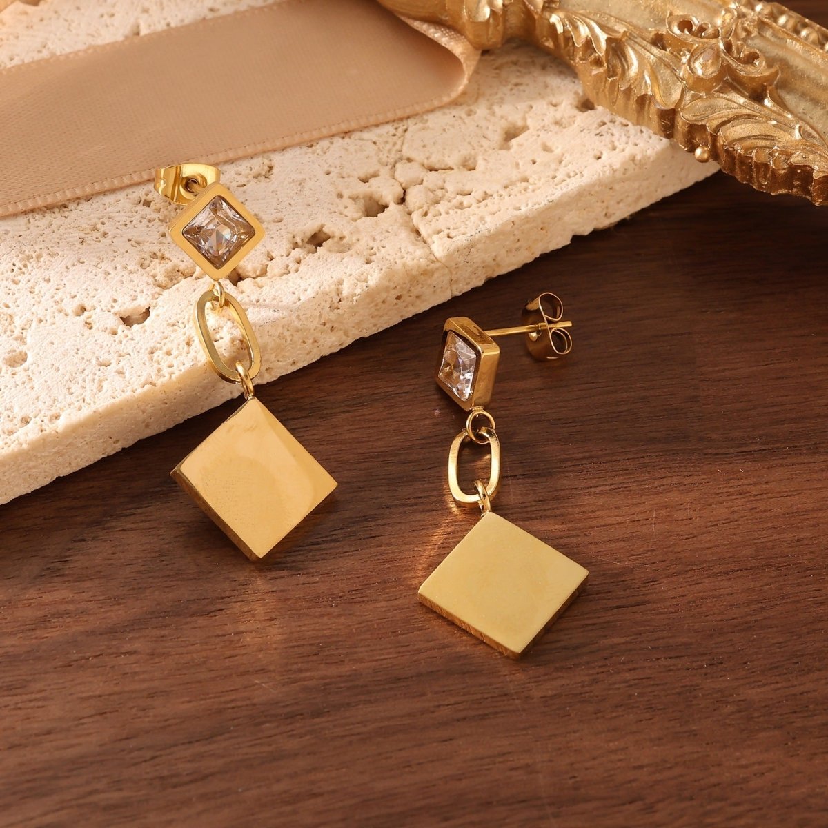 Elegant Flower Drop Earrings With Zircon And Gold Plated Finish - TIRAAYA