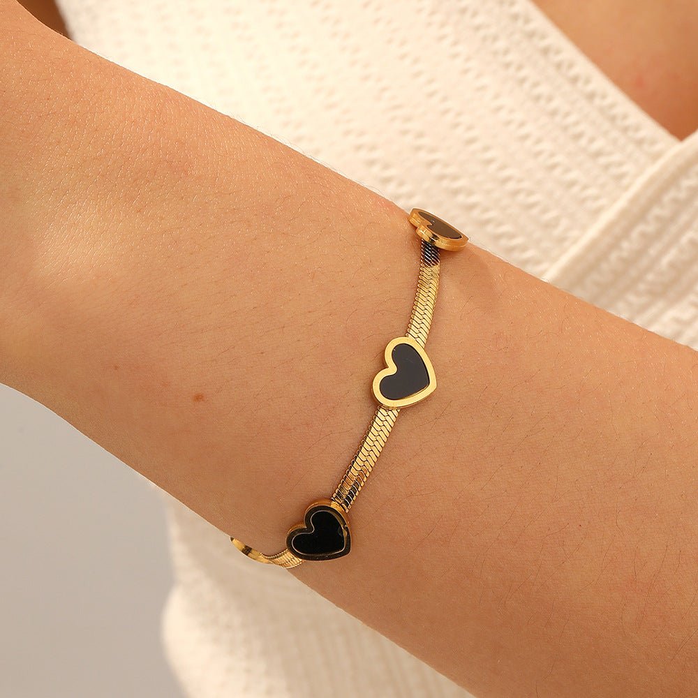 Elegant Heart Multi Pendant Bracelet With Gold Plated Finish - TIRAAYA