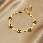 Elegant Heart Multi Pendant Bracelet With Gold Plated Finish - TIRAAYA