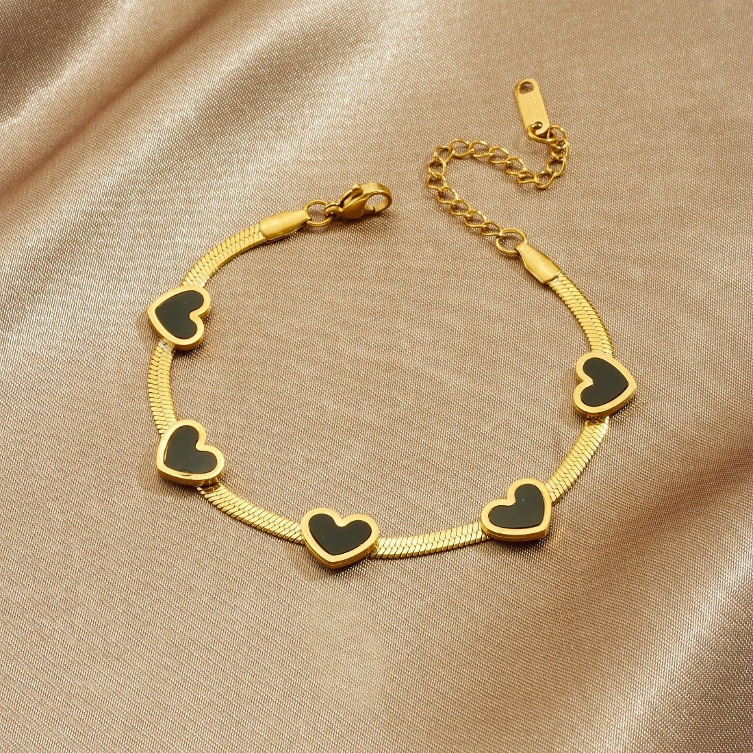 Elegant Heart Multi Pendant Bracelet With Gold Plated Finish - TIRAAYA