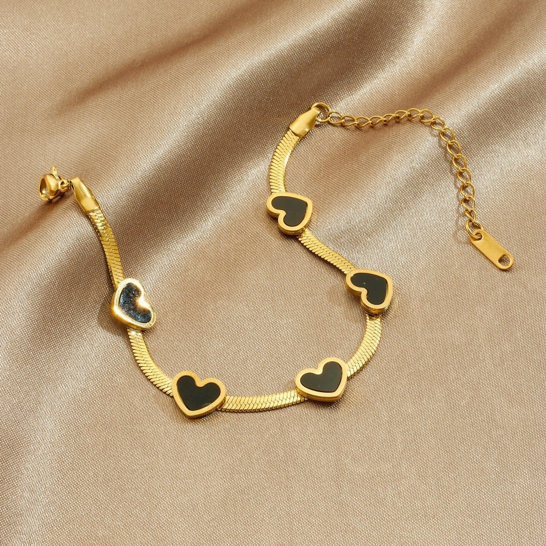 Elegant Heart Multi Pendant Bracelet With Gold Plated Finish - TIRAAYA