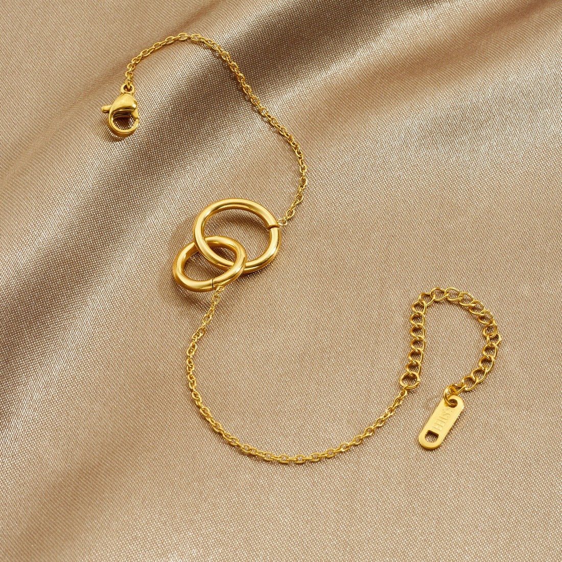 Double Ring Bracelet With Interlocking Gold Plated Design - TIRAAYA