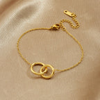 Double Ring Bracelet With Interlocking Gold Plated Design - TIRAAYA