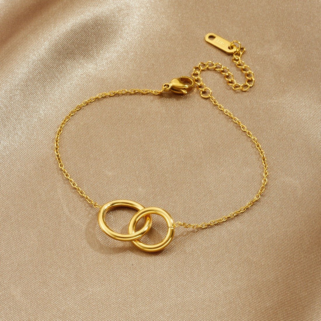 Double Ring Bracelet With Interlocking Gold Plated Design - TIRAAYA