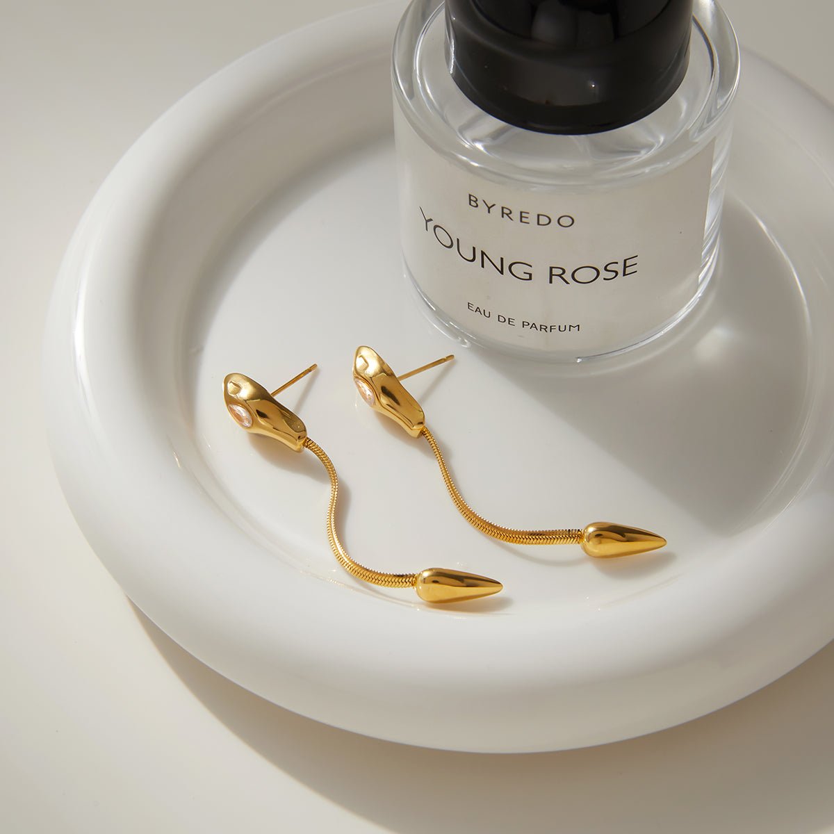 Elegant Snake Tassel Earrings With Zircon And Gold Plated Finish - TIRAAYA