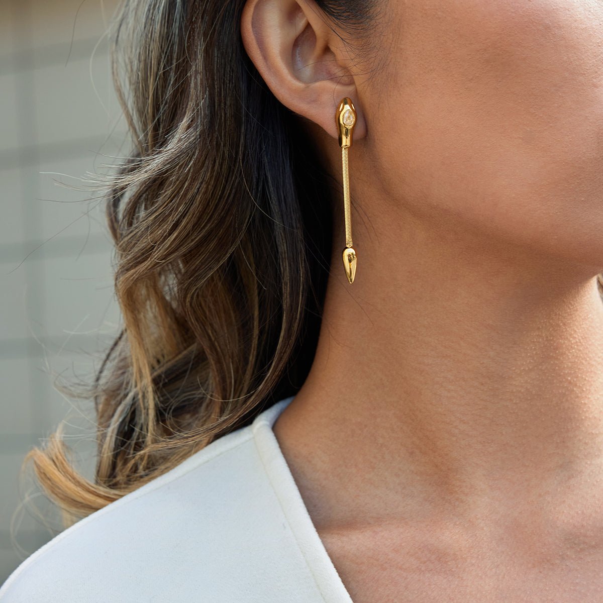 Elegant Snake Tassel Earrings With Zircon And Gold Plated Finish - TIRAAYA