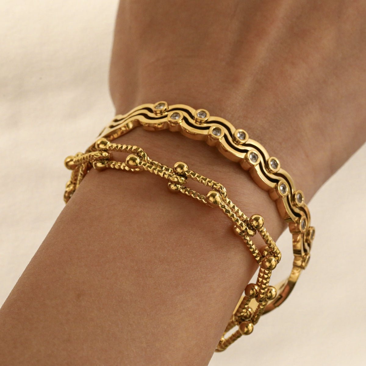 Elegant Waves Zircon Gold Plated Stainless Steel Bangle - TIRAAYA