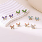Elegant Butterfly Stud Earrings With Enamel And Gold Plated Finish - TIRAAYA